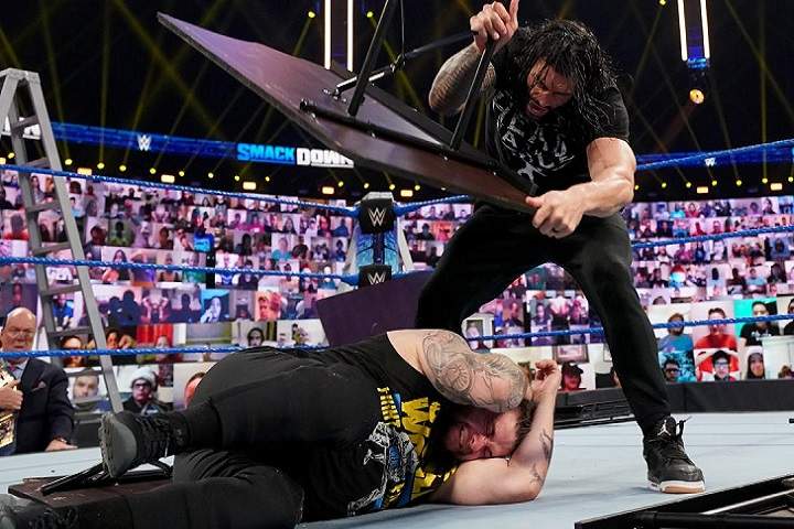 Roman Reigns Buries Kevin Owens Under Tables, Ladders, And C...